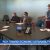 forum with several researchers around a table